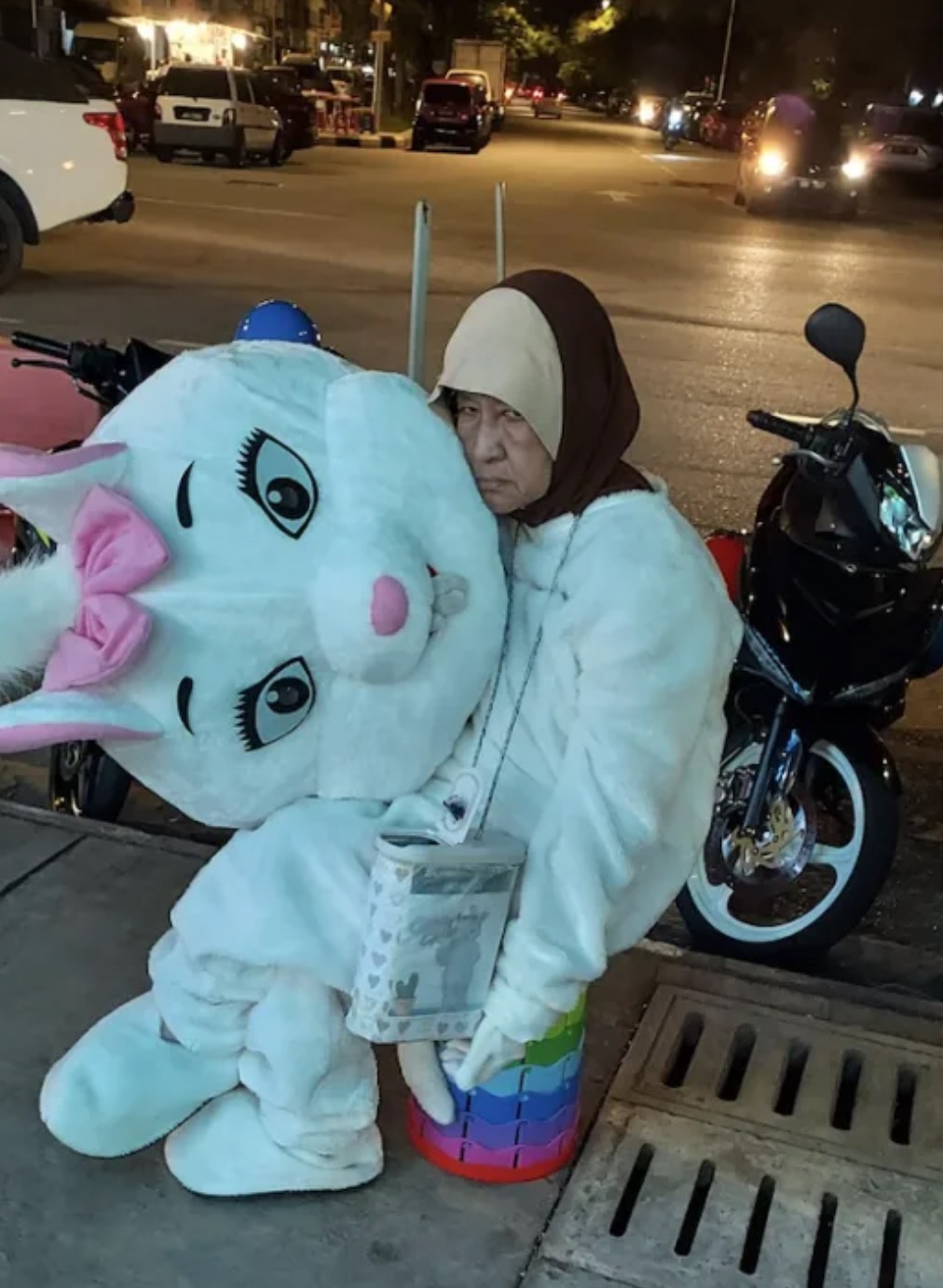 elderly lady works as mascot